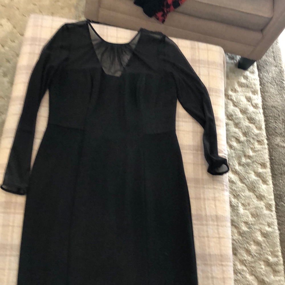 Beautiful black dress with illusion detailing.